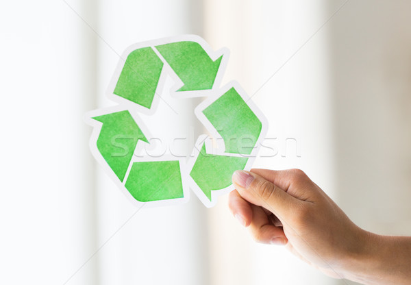 close up of hand holding green recycle symbol Stock photo © dolgachov