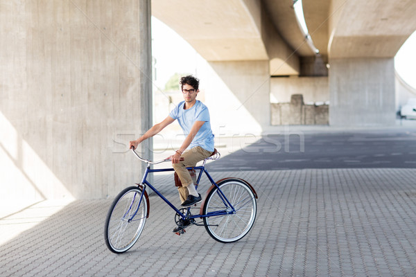 Jeunes homme équitation fixé engins [[stock_photo]] © dolgachov