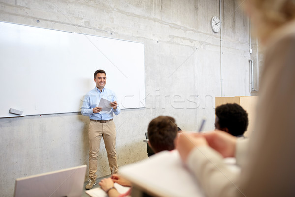 group of students and teacher at lecture Stock photo © dolgachov