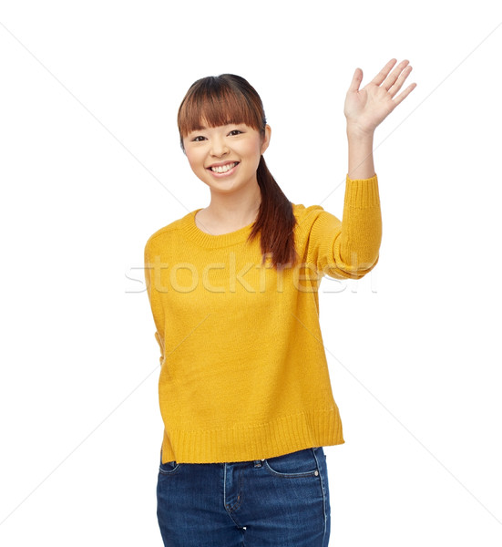 happy asian young woman waving hand over white Stock photo © dolgachov