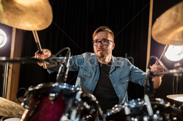Stock photo: male musician playing drums and cymbals at concert