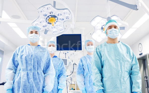 group of surgeons in operating room at hospital Stock photo © dolgachov