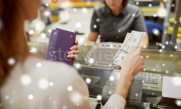 woman paying money at store cash register Stock photo © dolgachov
