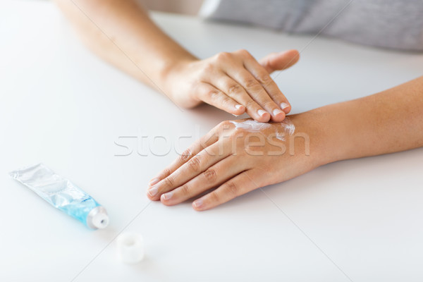 close up of hands with cream or therapeutic salve Stock photo © dolgachov