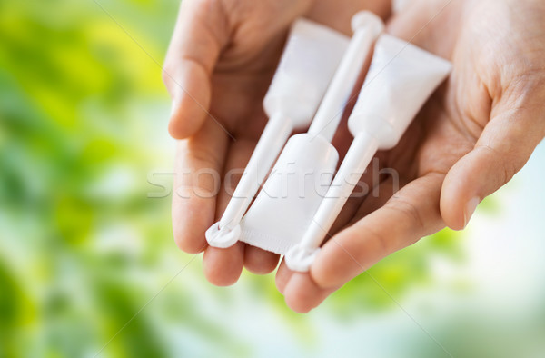 hand holding tubes of micro enema Stock photo © dolgachov