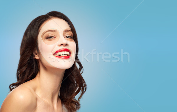 beautiful young woman with hydrogel mask on face Stock photo © dolgachov