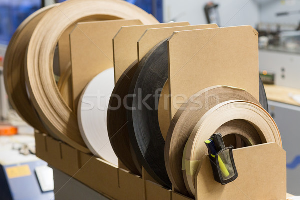Stock photo: veneer or edge band tapes at woodworking factory