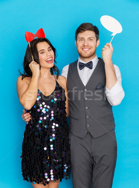 happy couple with party props having fun Stock photo © dolgachov