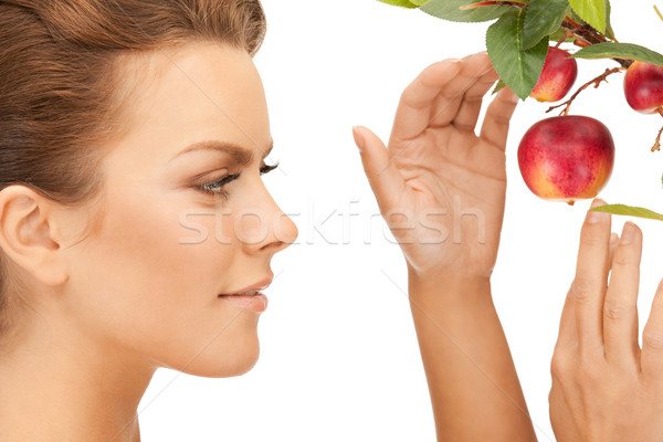 Stock photo: lovely woman with apple twig