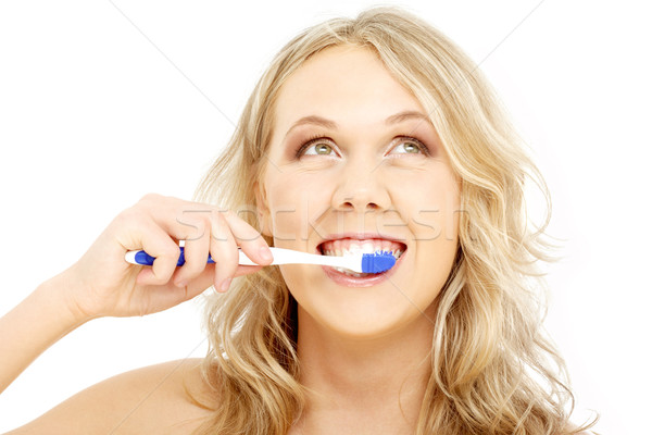 happy blond with toothbrush Stock photo © dolgachov