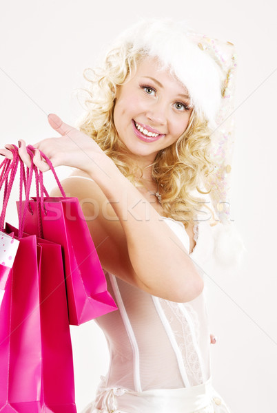 cheerful santa helper girl with shopping bags Stock photo © dolgachov