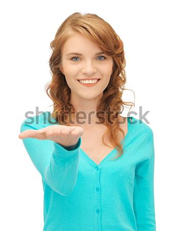 girl showing something on the palm of her hand Stock photo © dolgachov