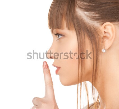 happy woman with finger on lips Stock photo © dolgachov