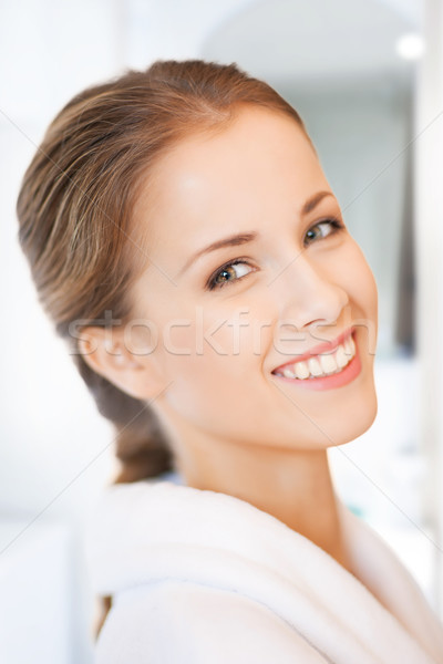 beautiful woman in white bathrobe Stock photo © dolgachov