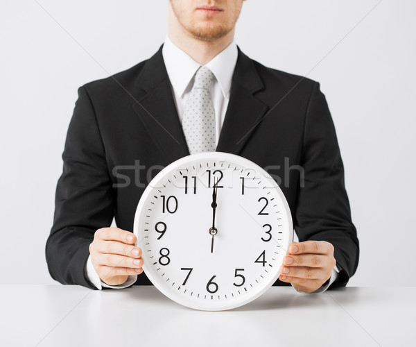Stock photo: man with wall clock