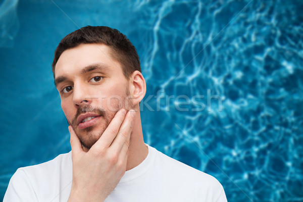Schönen Mann anfassen Gesicht Gesundheit Stock foto © dolgachov