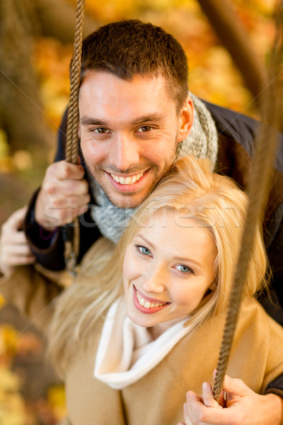 smiling couple hugging in autumn park Stock photo © dolgachov