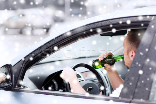 close up of man drinking alcohol while driving car Stock photo © dolgachov