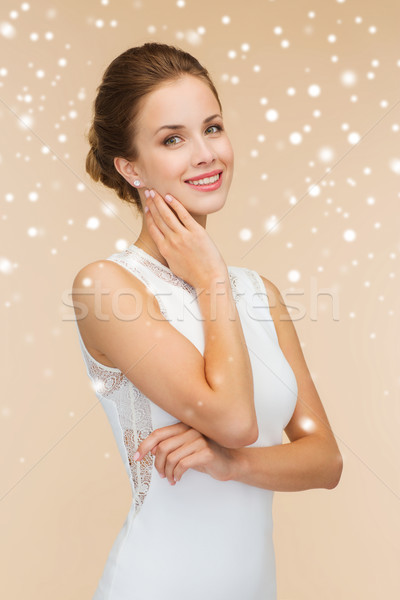 улыбающаяся женщина белое платье кольцо с бриллиантом праздников празднования свадьба Сток-фото © dolgachov