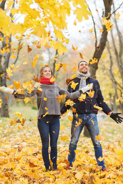 smiling couple having fun in autumn park Stock photo © dolgachov