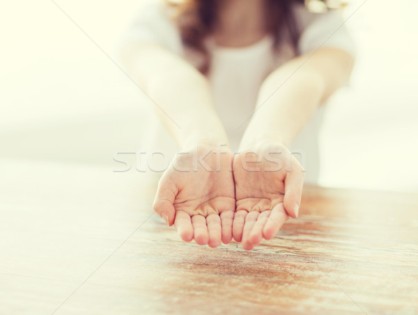 close up of little girl showing empty cupped hands Stock photo © dolgachov