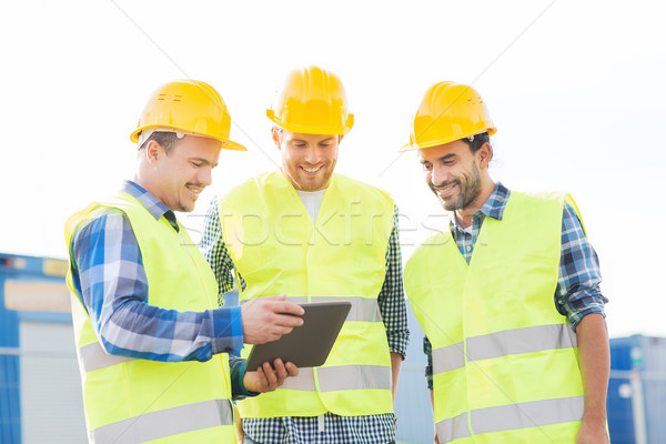 Sorridente construtores negócio edifício trabalho em equipe Foto stock © dolgachov