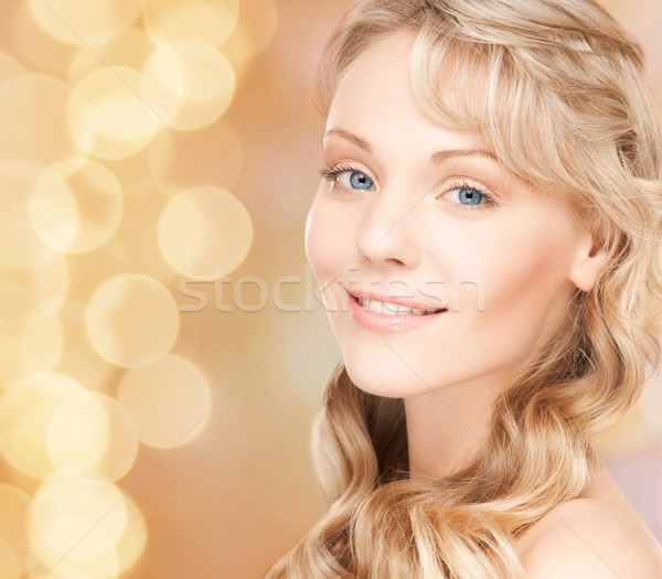 beautiful young woman face with long wavy hair Stock photo © dolgachov