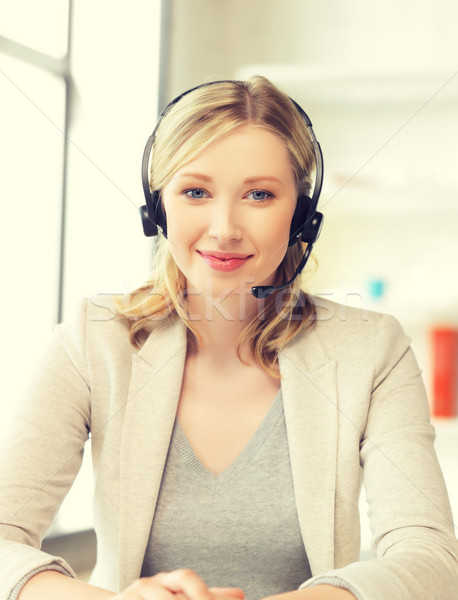 Stock photo: friendly female helpline operator