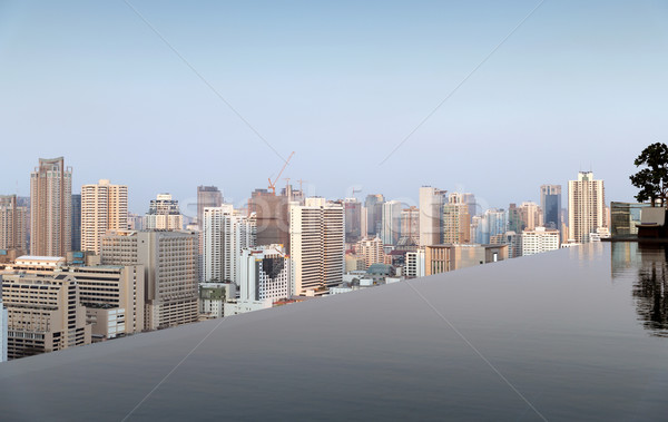 view from infinity edge pool to bangkok city Stock photo © dolgachov