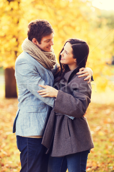 smiling couple hugging in autumn park Stock photo © dolgachov