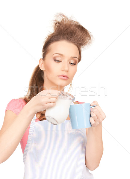 housewife with milk and mug Stock photo © dolgachov