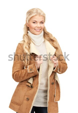 beautiful woman in sheepskin jacket Stock photo © dolgachov