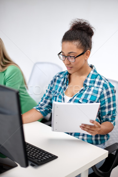 happy high school students in computer class Stock photo © dolgachov