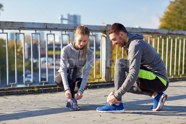 Mosolyog pár cipőfűző kint fitnessz sport Stock fotó © dolgachov