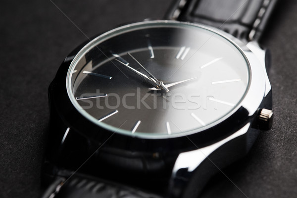 close up of black classic male wristwatch Stock photo © dolgachov