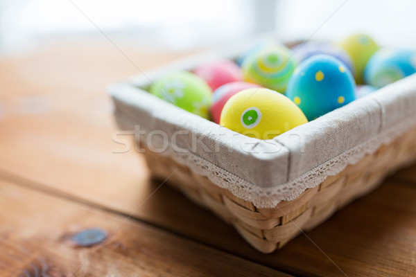 close up of colored easter eggs in basket Stock photo © dolgachov