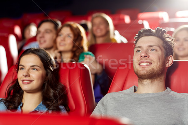 happy friends watching movie in theater Stock photo © dolgachov