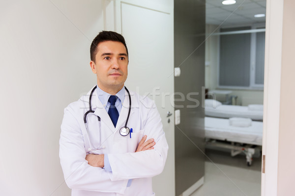 doctor in white coat at hospital Stock photo © dolgachov