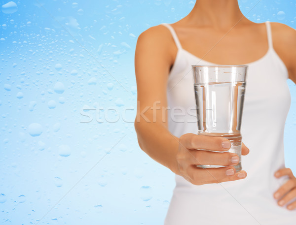 Kadın el cam su Stok fotoğraf © dolgachov