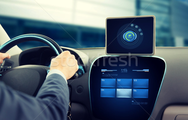 close up of man with tablet pc driving car Stock photo © dolgachov