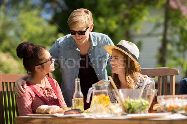 happy friends having dinner at summer garden party Stock photo © dolgachov