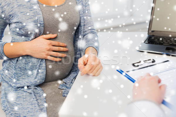 close up of doctor and pregnant woman at hospital Stock photo © dolgachov