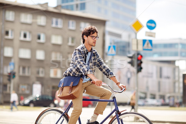 Jeunes homme sac équitation fixé [[stock_photo]] © dolgachov