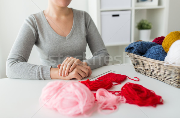 woman with knitting needles and yarn in basket Stock photo © dolgachov