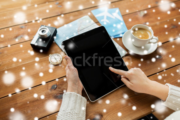 close up of traveler hands with tablet pc and map Stock photo © dolgachov