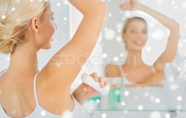 woman with antiperspirant deodorant at bathroom Stock photo © dolgachov