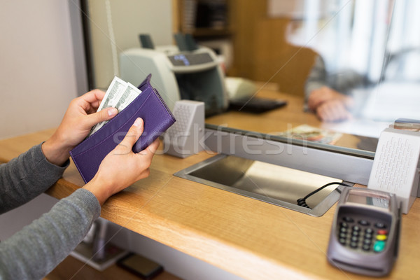 hands with money at bank or currency exchanger Stock photo © dolgachov