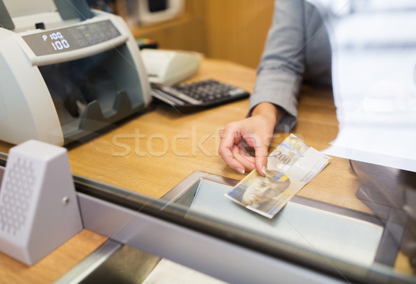 clerk with swiss francs cash money at bank office Stock photo © dolgachov