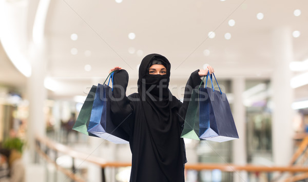 muslim woman in hijab with shopping bags Stock photo © dolgachov