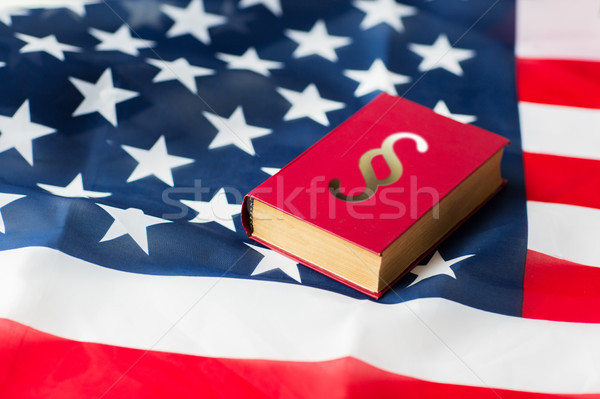 close up of american flag and lawbook Stock photo © dolgachov